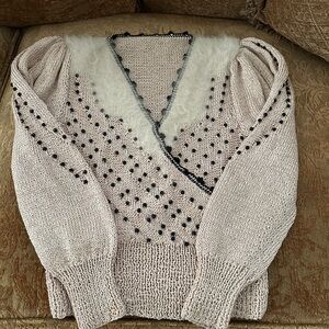 Elegant Cream Sweater with Black Accents